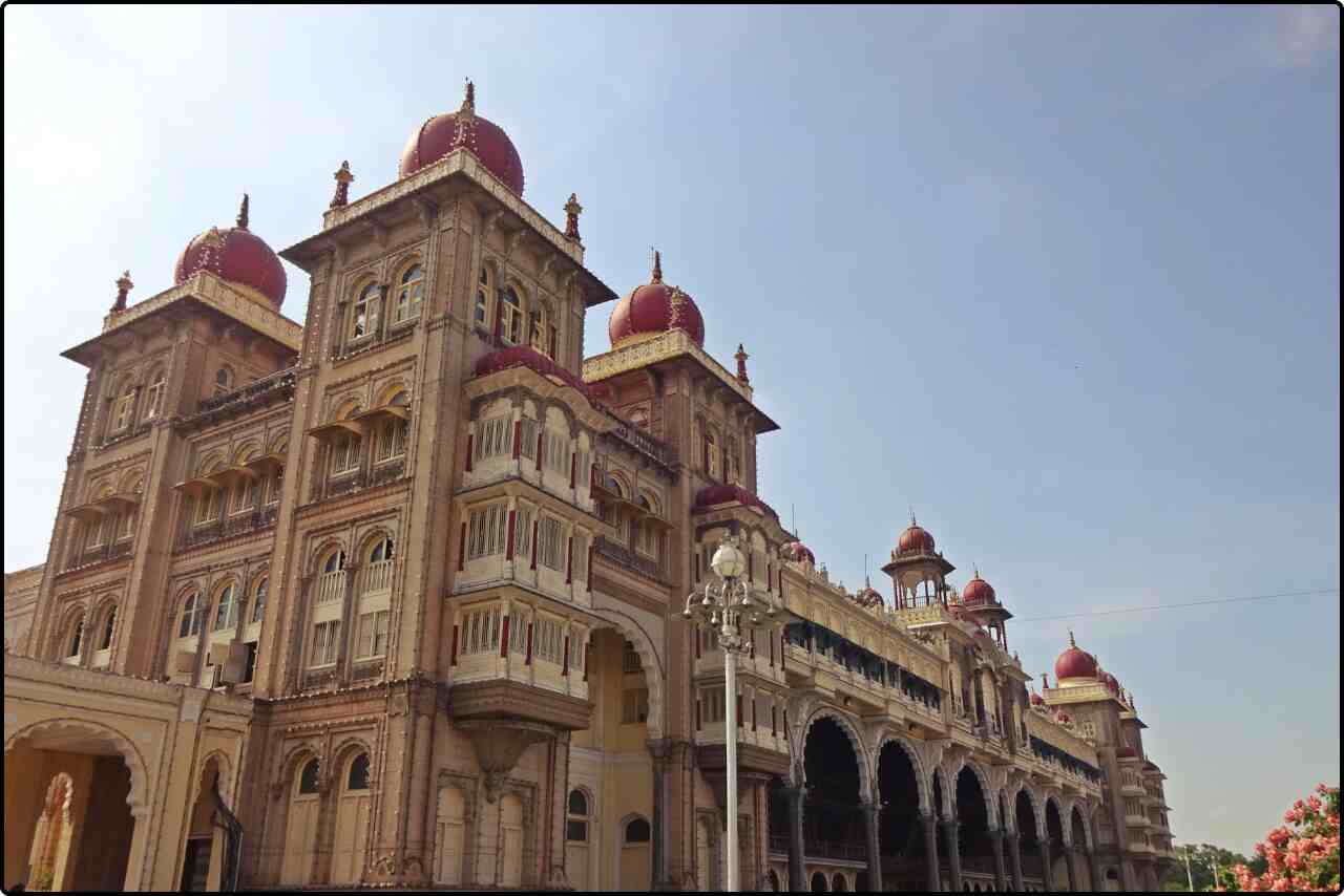 Historic Mysore Palace during the day, showcasing its grand Indo-Saracenic architecture.